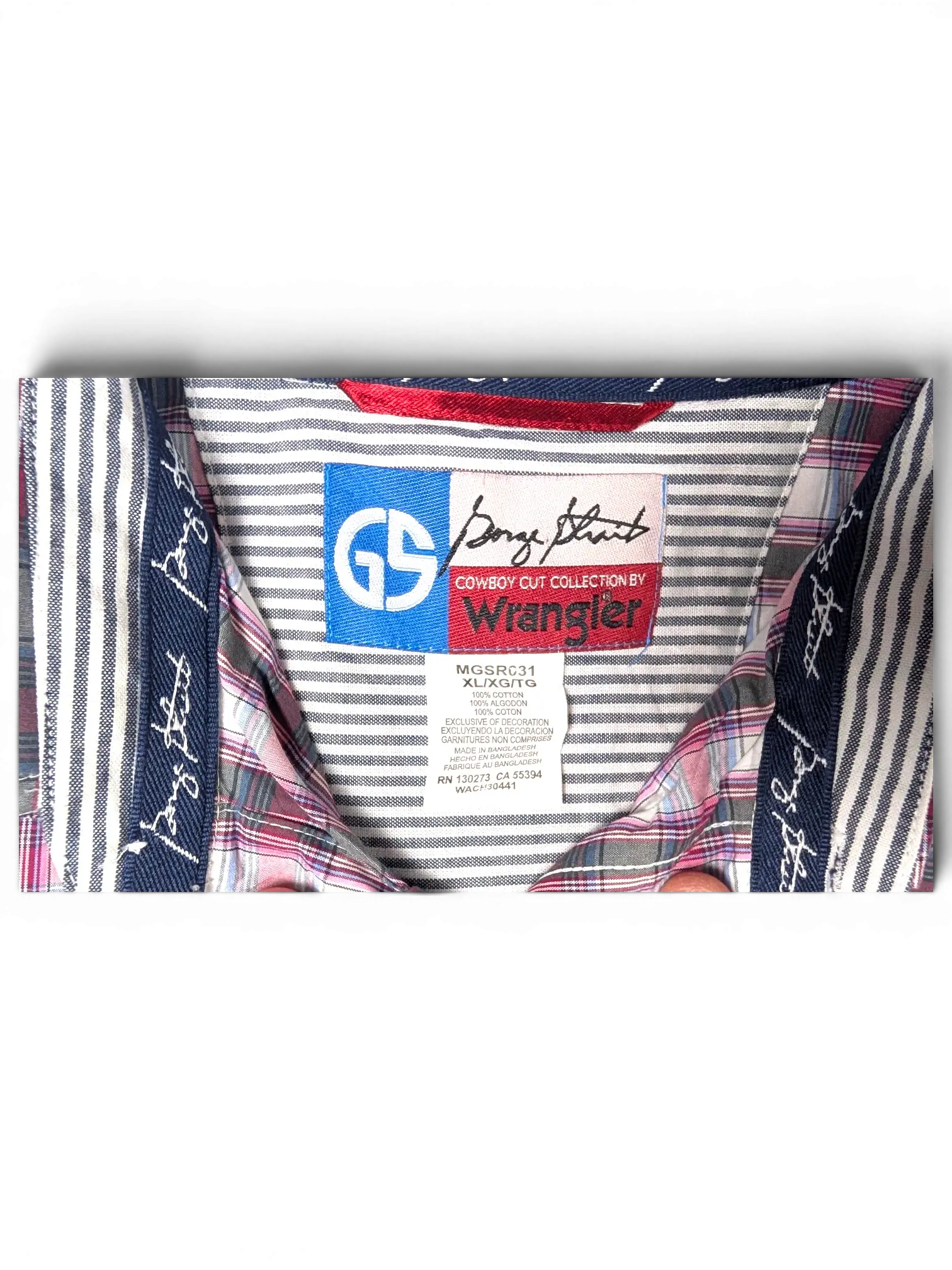 JAKE & IPI vintage Wrangler plaid short sleeve shirt label showing pink, navy, and white cotton fabric details