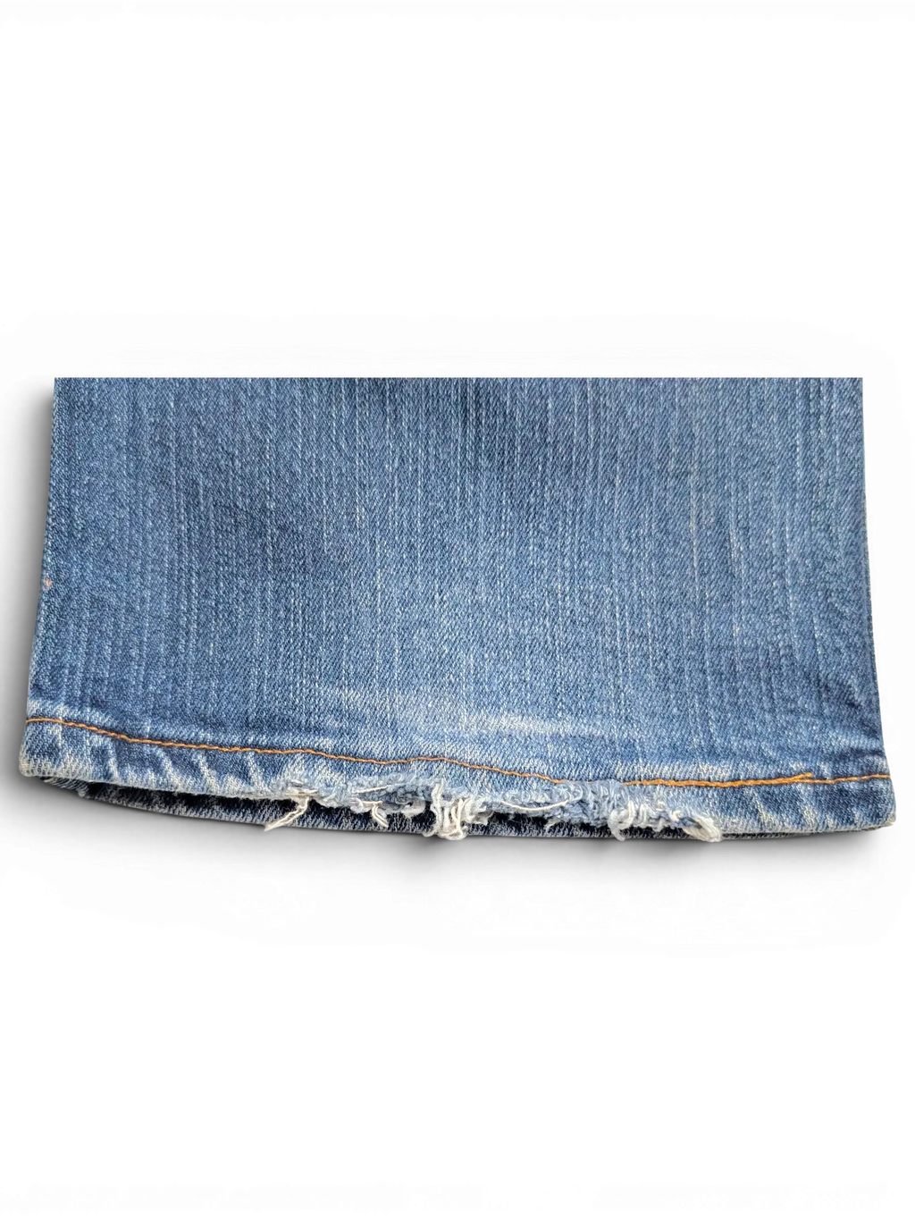 JAKE & IPI Wrangler Q-BABY blue denim jeans hem showing distressed frayed edges and contrast stitching