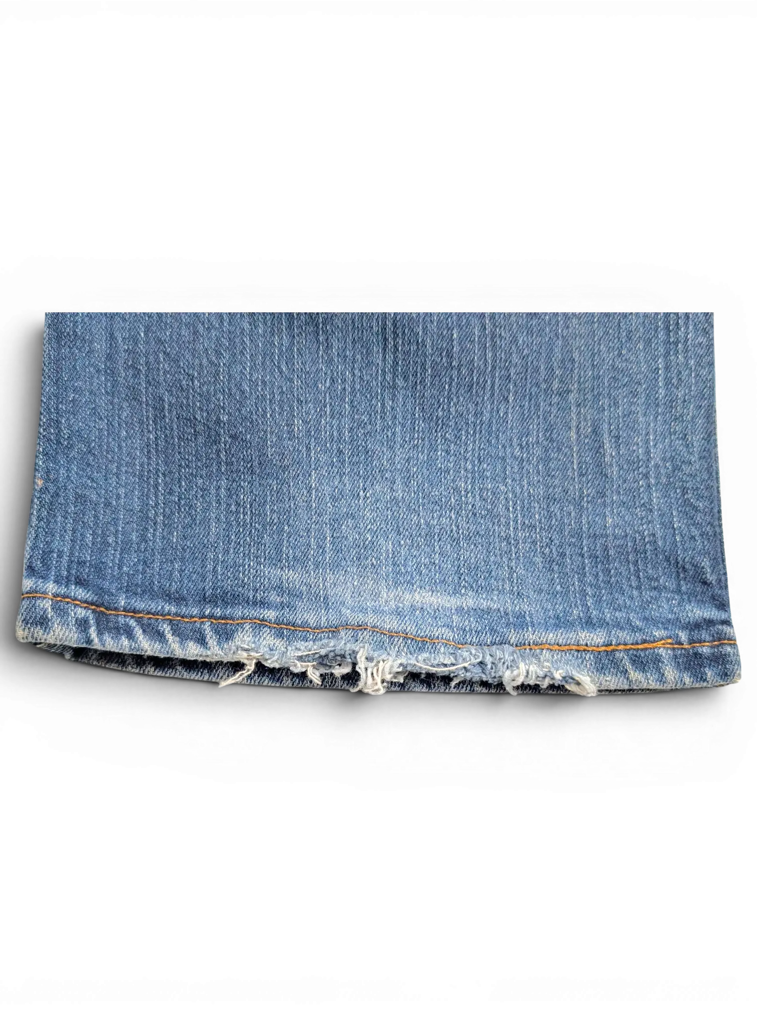 JAKE & IPI Wrangler Q-BABY blue denim jeans hem showing distressed frayed edges and contrast stitching
