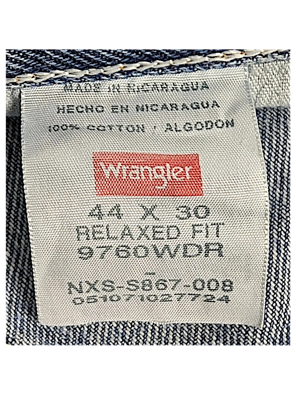 JAKE & IPI Wrangler relaxed fit jeans interior label showing 44x30 size and 100 percent cotton material