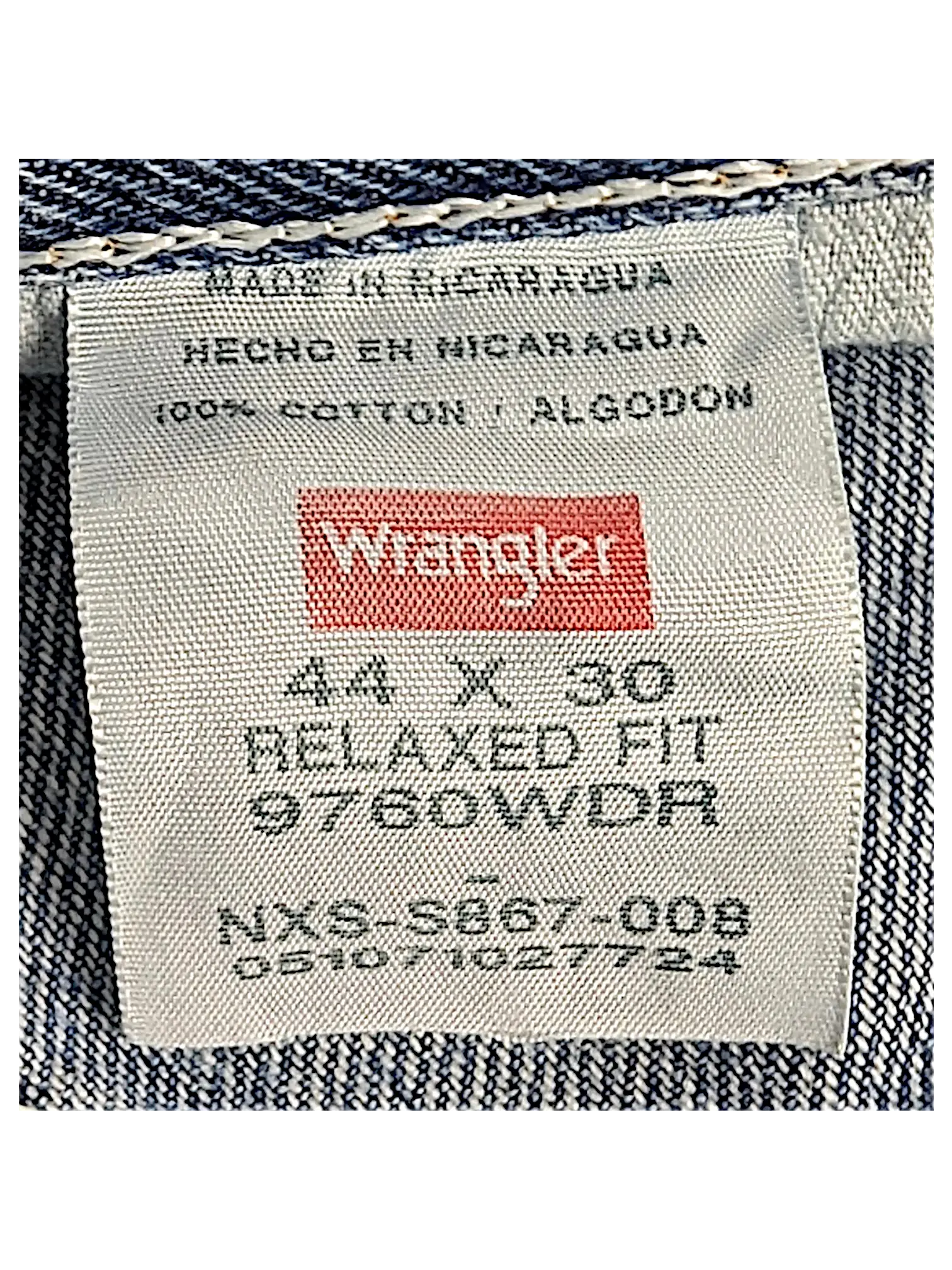 JAKE & IPI Wrangler relaxed fit jeans interior label showing 44x30 size and 100 percent cotton material