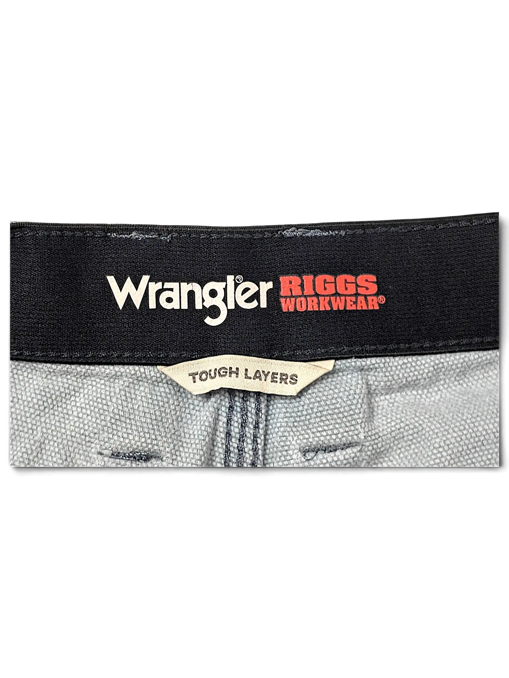 JAKE & IPI Wrangler Riggs Workwear pants featuring a black waistband with branded logo and Tough Layers label