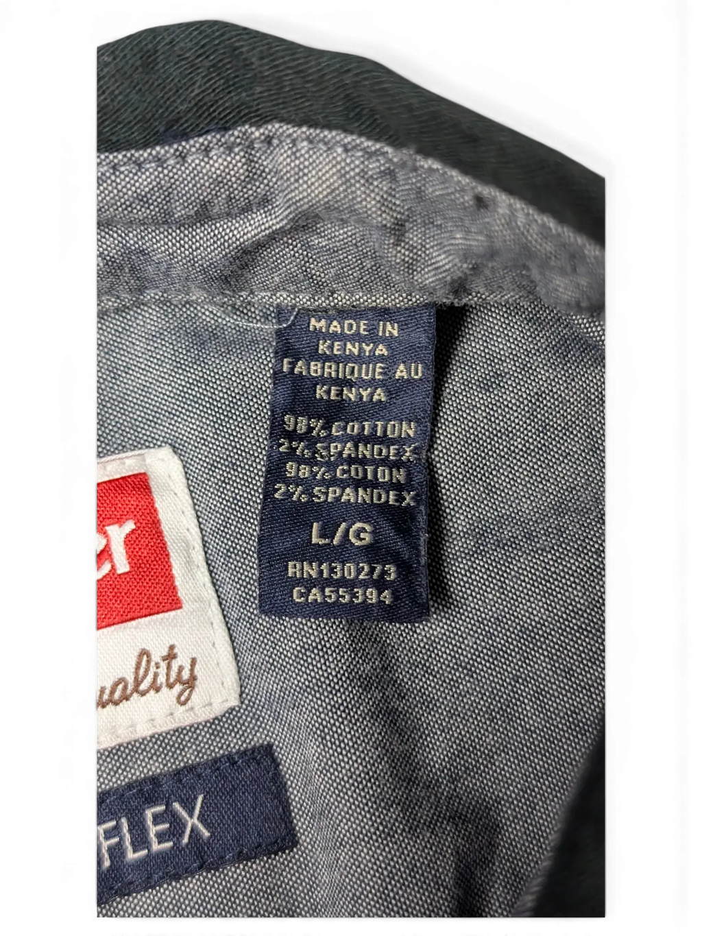 JAKE & IPI Wrangler black utility shirt fabric care label showing cotton and spandex blend made in Kenya