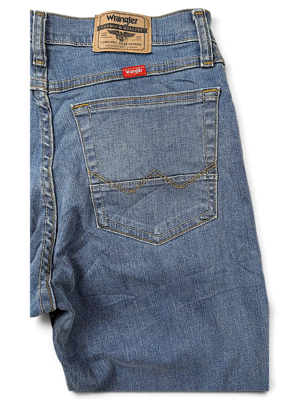 JAKE & IPI Wrangler straight fit blue denim jeans featuring a leather brand patch and signature back pocket stitching.
