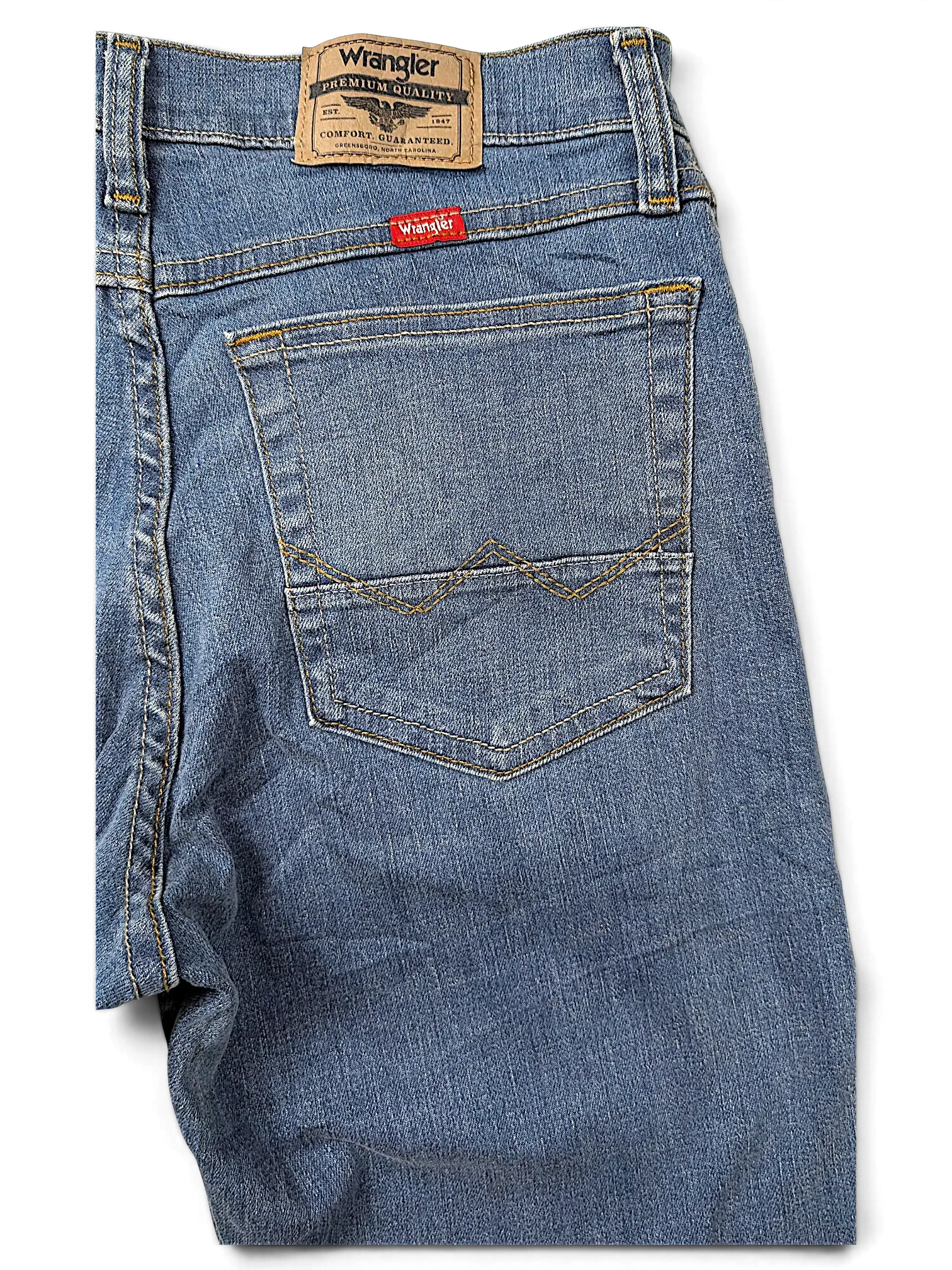 JAKE & IPI Wrangler straight fit blue denim jeans featuring a leather brand patch and signature back pocket stitching.