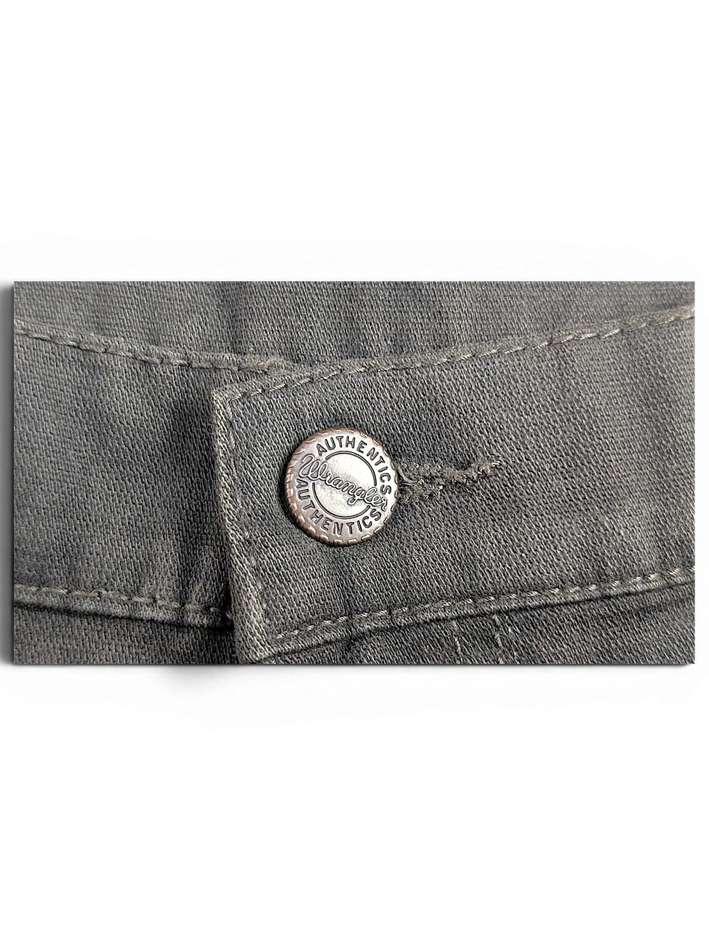 JAKE & IPI Wrangler Texas stretch pants featuring a branded metal button closure on grey denim fabric