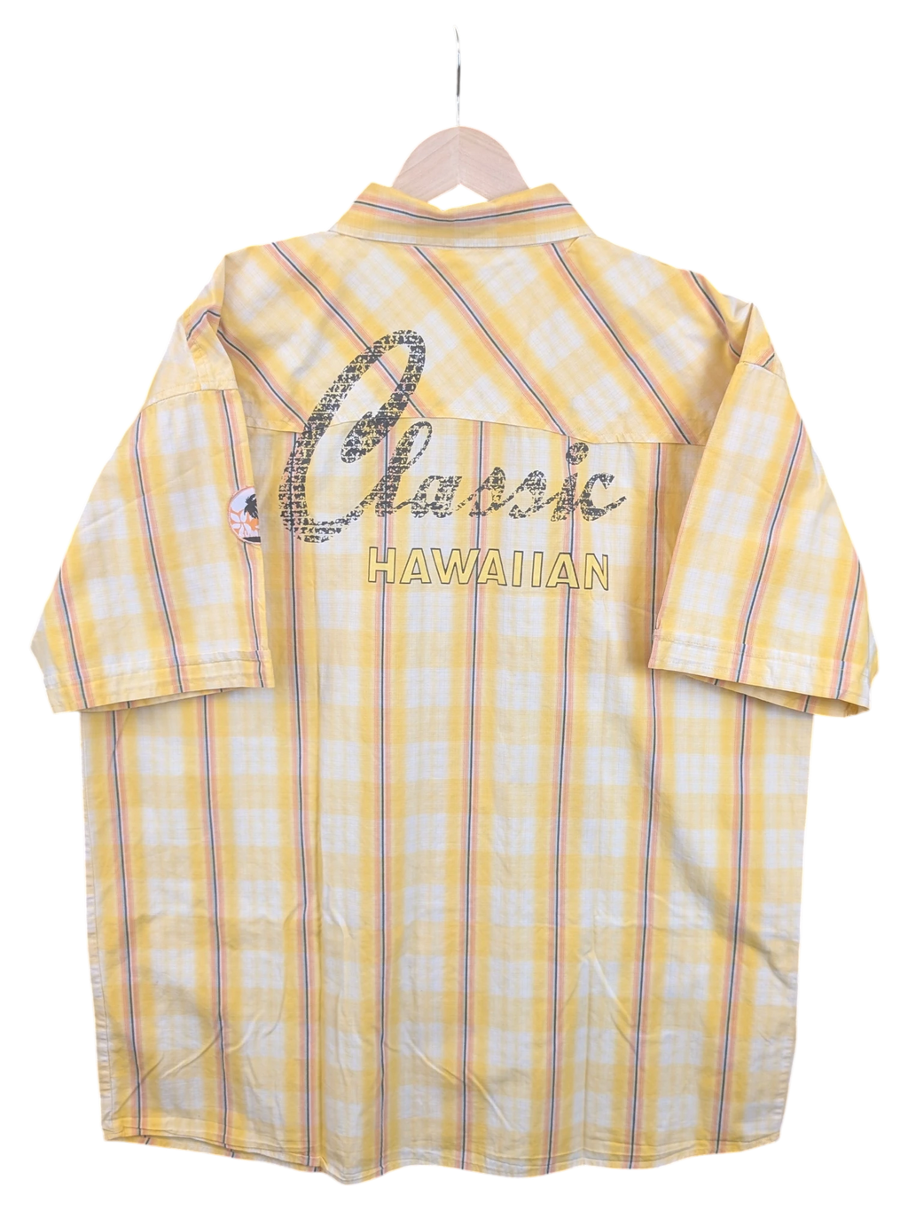 Back view of a JAKE & IPI yellow plaid Hawaiian shirt with Classic Hawaiian text embroidery on the back yoke.