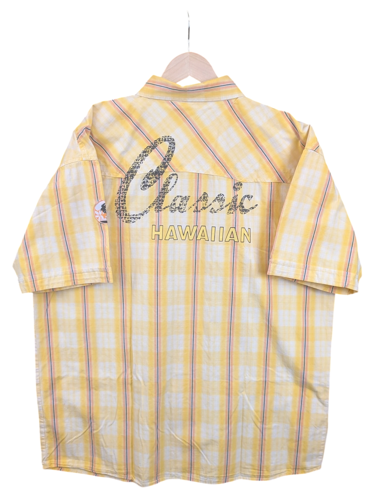 Back view of a JAKE & IPI yellow plaid Hawaiian shirt with Classic Hawaiian text embroidery on the back yoke.