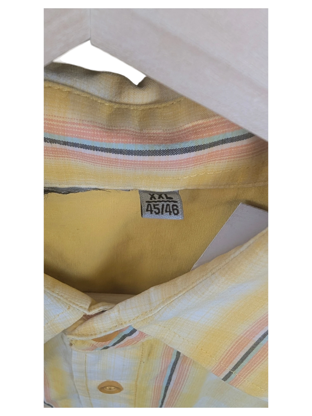 JAKE & IPI yellow Hawaiian shirt with pastel striped pattern and XXL size tag on a wooden hanger