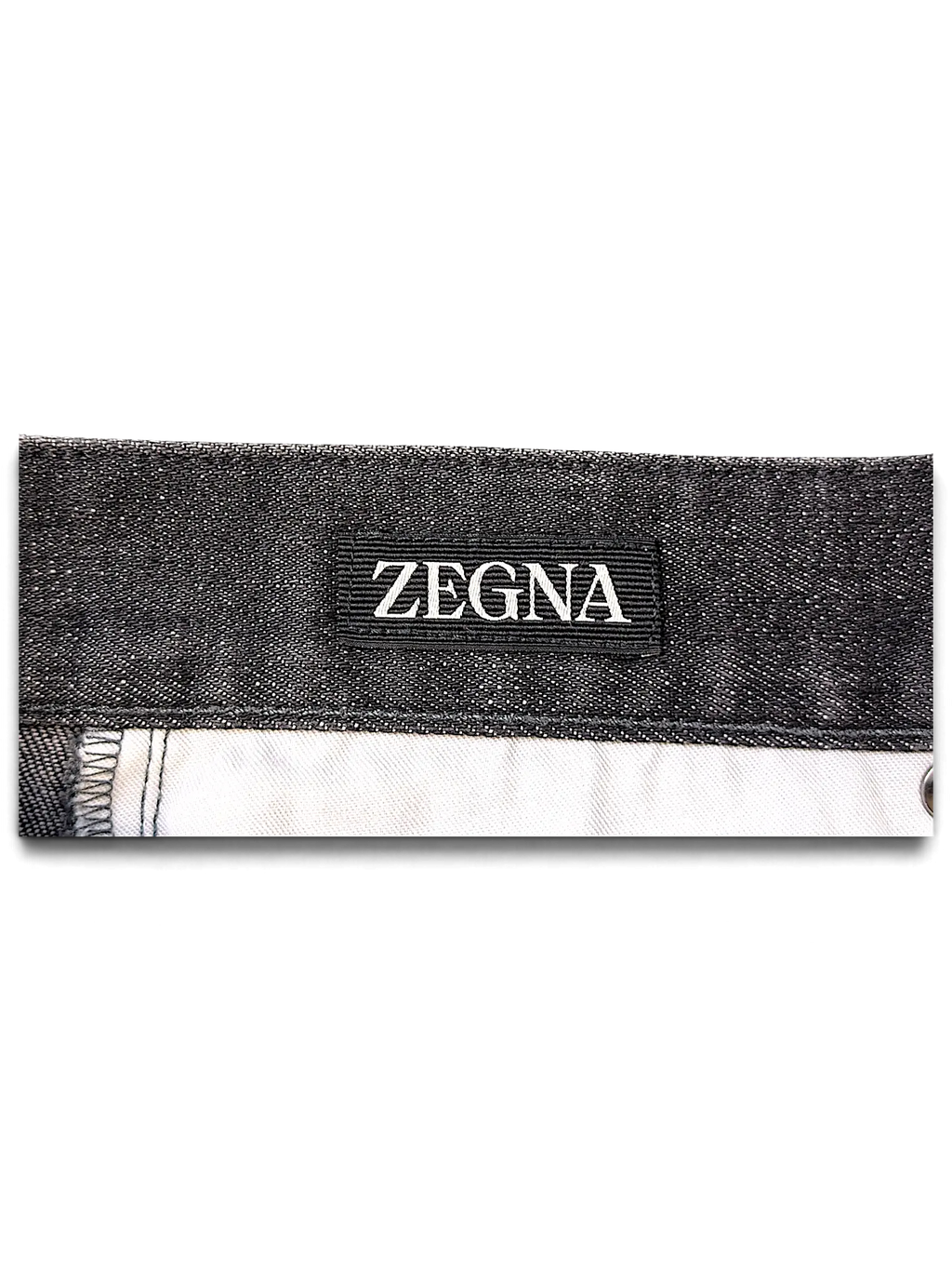 JAKE & IPI Zegna jeans featuring a black denim waistband with a prominent Zegna brand label