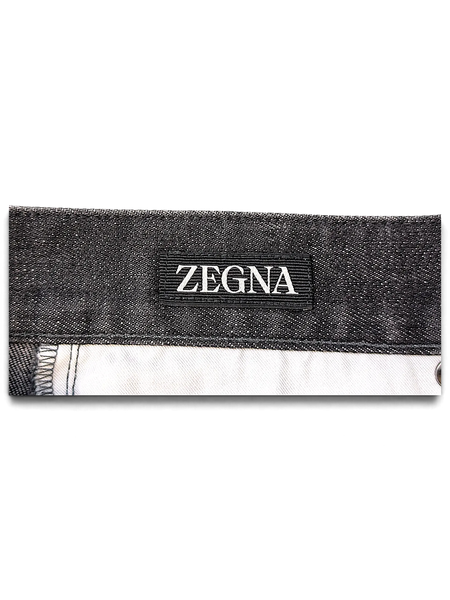 JAKE & IPI Zegna jeans featuring a black denim waistband with a prominent Zegna brand label