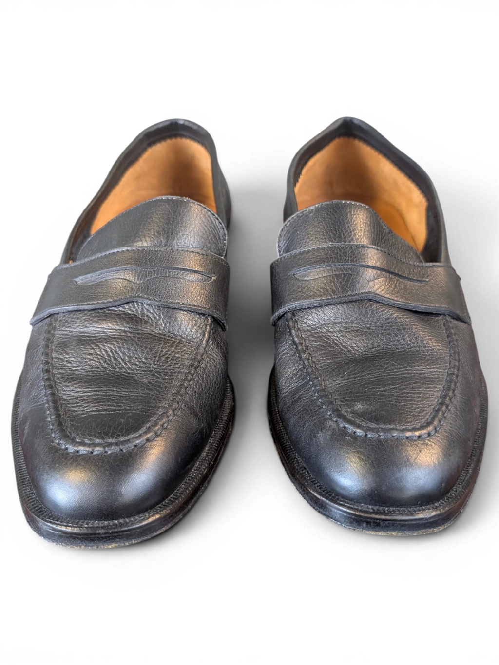 JAKE & IPI Zenith black leather penny loafers featuring a classic slip-on design with textured leather finish.