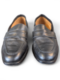JAKE & IPI Zenith black leather penny loafers featuring a classic slip-on design with textured leather finish.