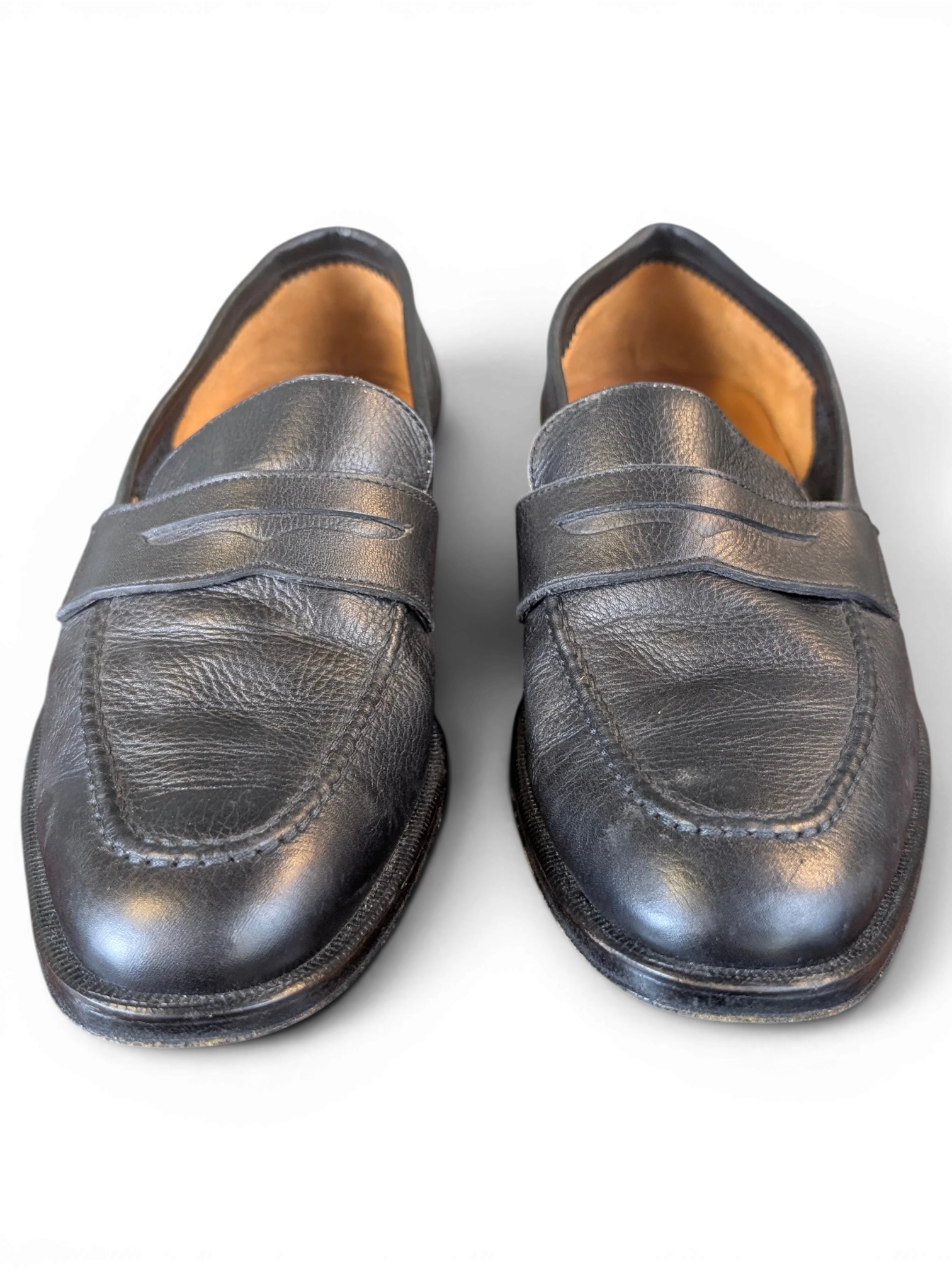 JAKE & IPI Zenith black leather penny loafers featuring a classic slip-on design with textured leather finish.