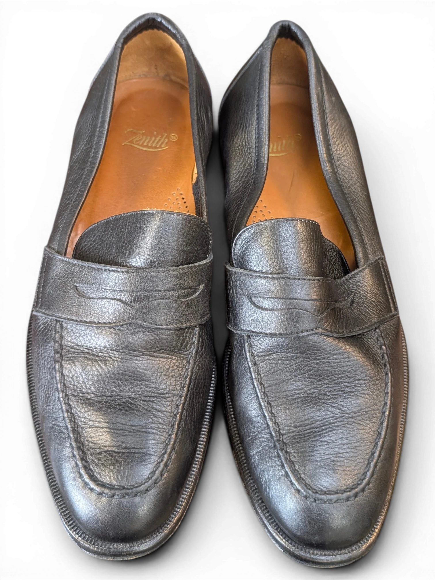 JAKE & IPI Zenith black leather penny loafers with a classic slip-on design and tan leather insoles.